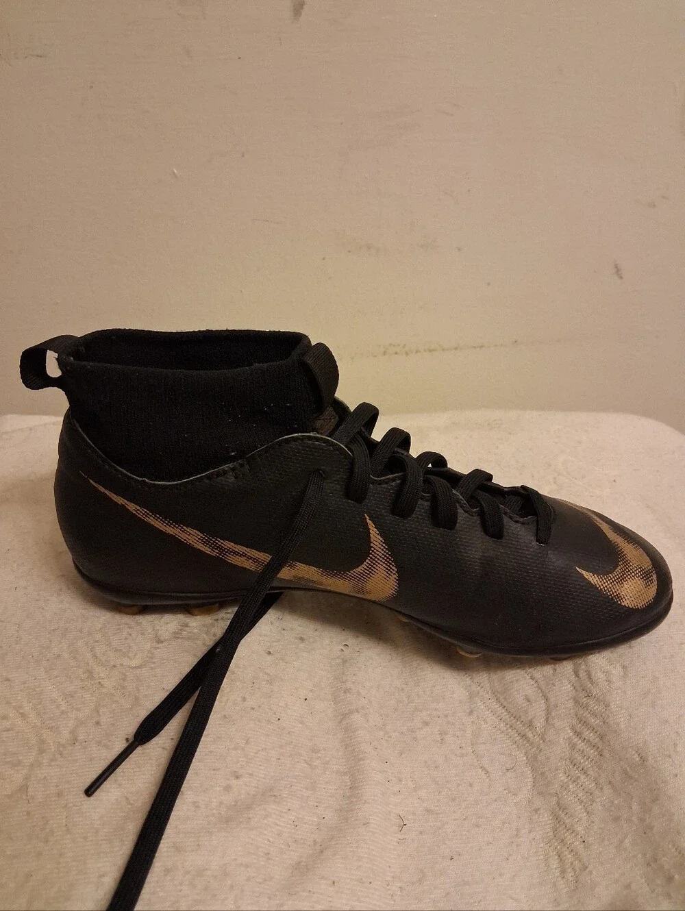 Youth Nike Black Cleats with Gold Swoosh Size 5Y